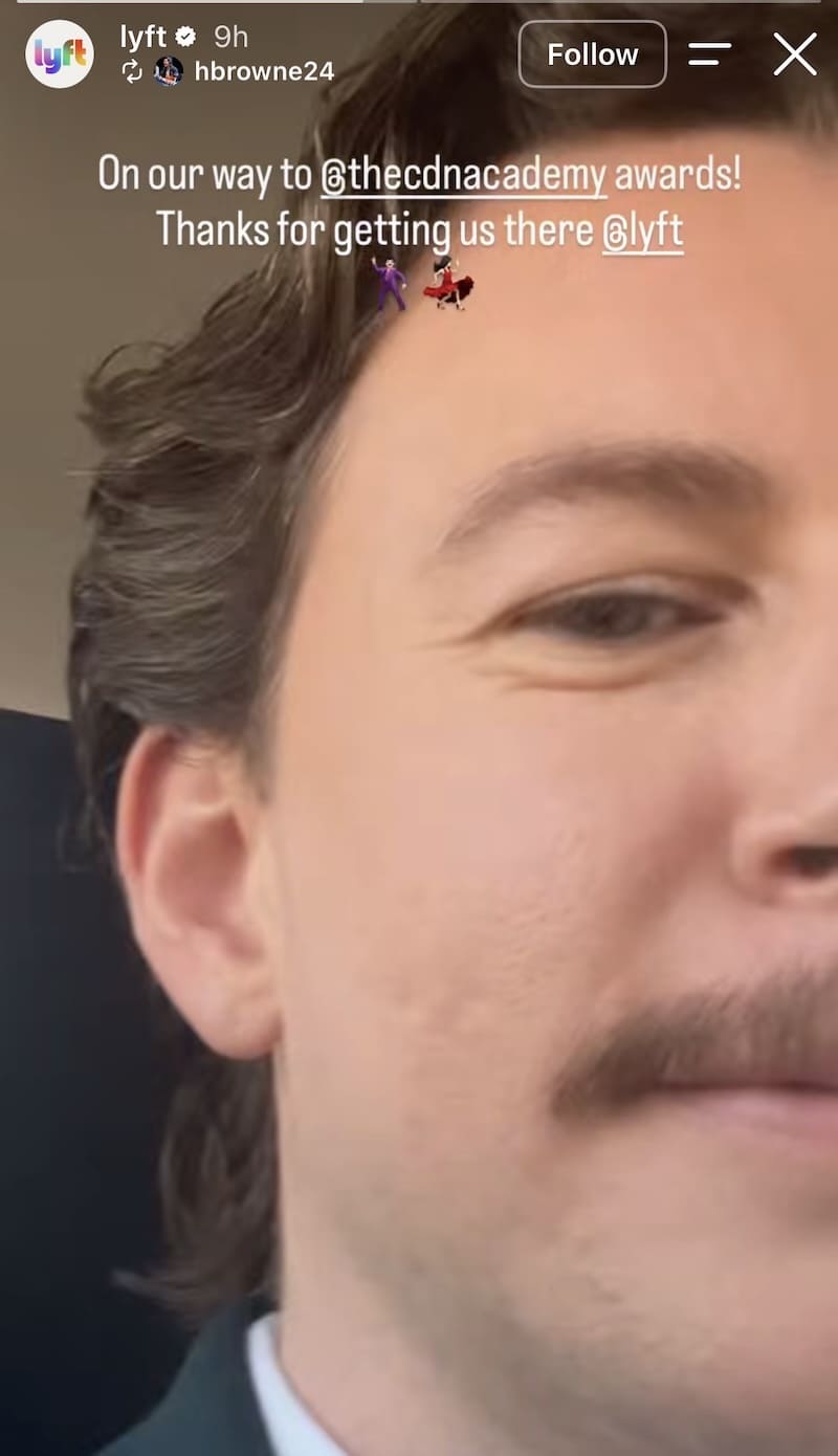 Lyft Story: close-up selfie of smiling man in suit, 'Thanks for getting us there @lyft' en route to CDNA Academy Awards.